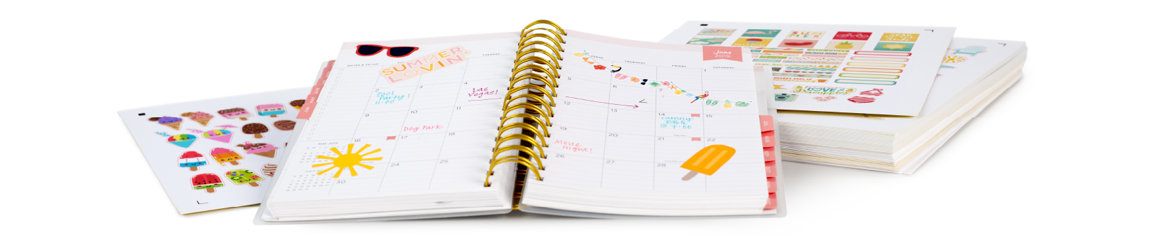 Open planner with colorful summer-themed stickers and notes, surrounded by additional sheets of stickers.