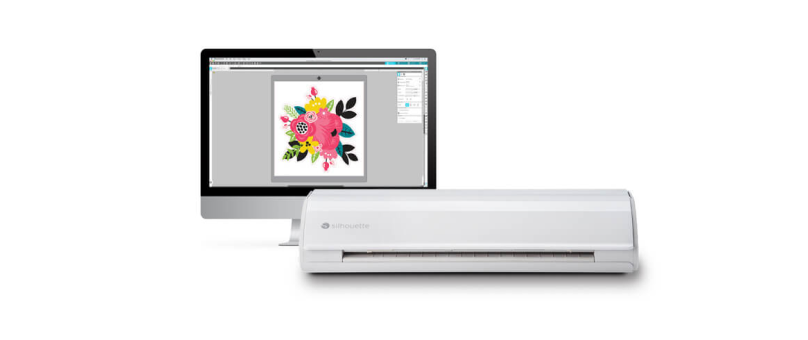 Image of a computer displaying floral design software, with a Silhouette cutting machine in front of it.