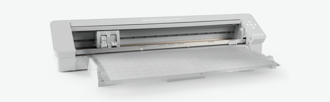 Image of a Cameo Plus cutting machine with a cutting mat loaded, featuring a grid pattern.